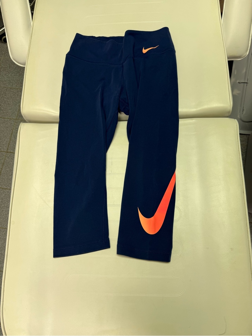 Nike Girls' Navy Capri Leggings with Bright Orange Swoosh Accents